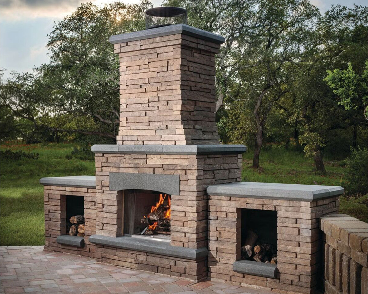 Belgard Bordeaux outdoor fireplace with stacked stone finish.