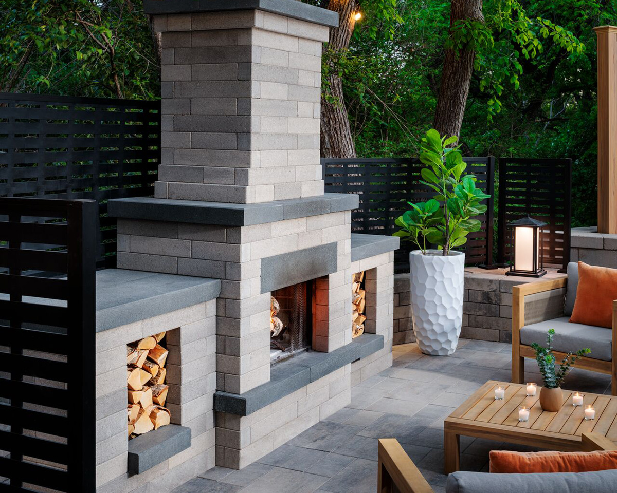 Melville Outdoor Fireplace with cast stone accents.